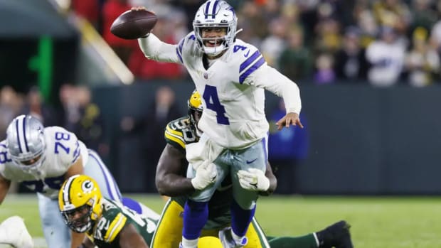 Dallas Cowboys quarterback Dak Prescott (4) throws a pass during overtime against the Green Bay Packers at Lambeau Field.